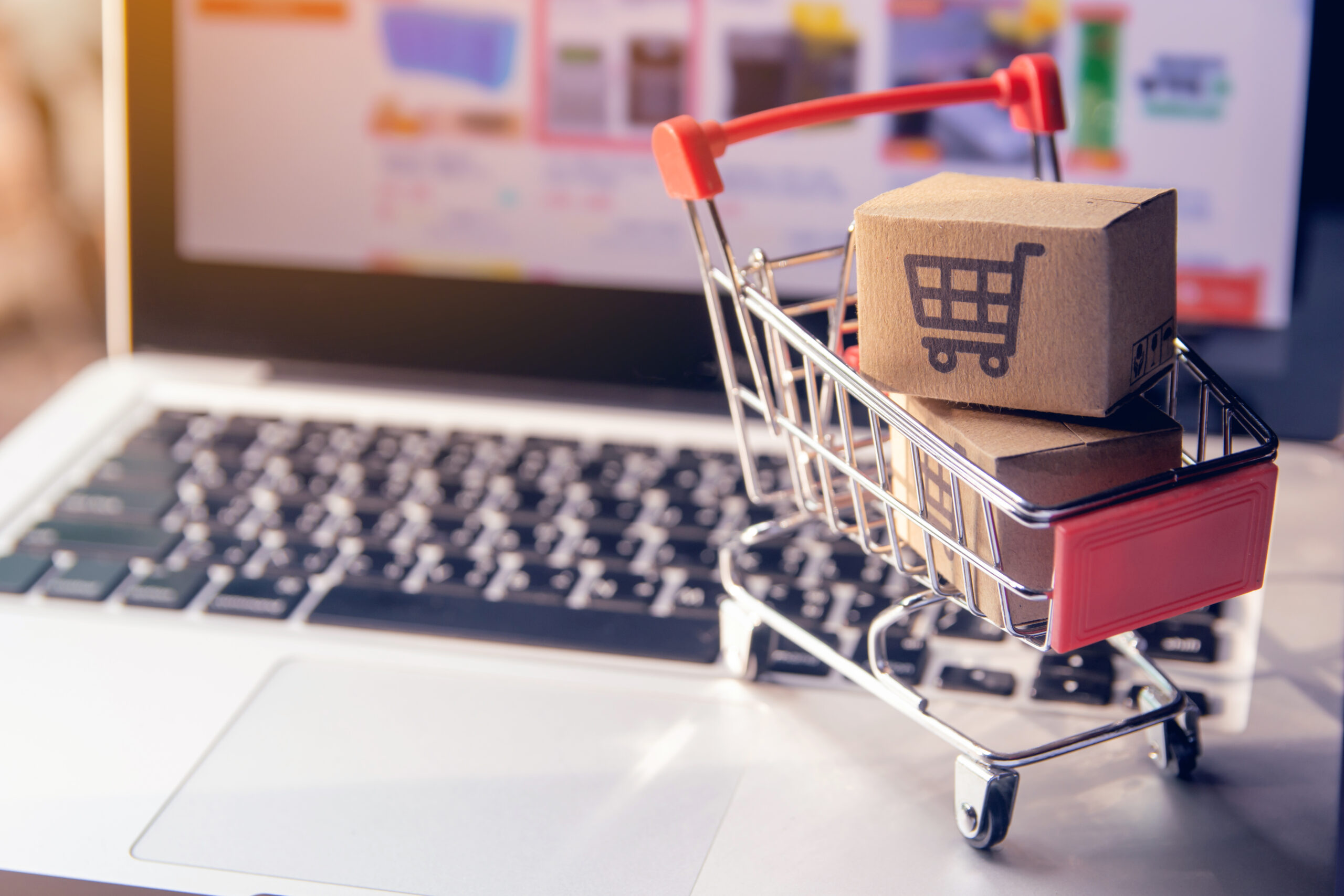 Shopping online concept – Parcel or Paper cartons with a shoppin